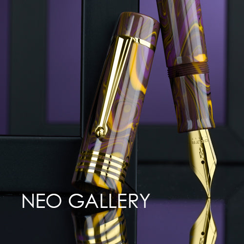 Delta pen with gold accents on a reflective surface, branded 'NEO GALLERY'.