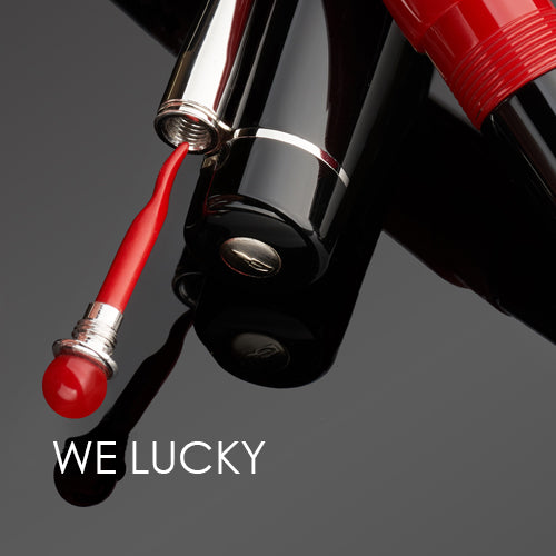 Delta 'WE LUCKY' pen close up on a dark background