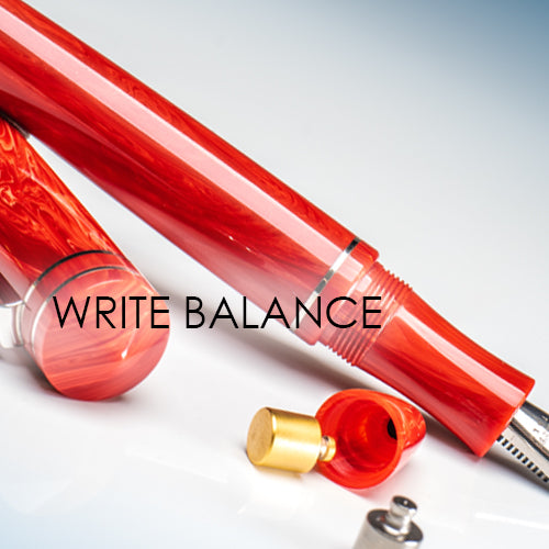Red pen with gold cap on a white background, featuring the text 'WRITE BALANCE'.